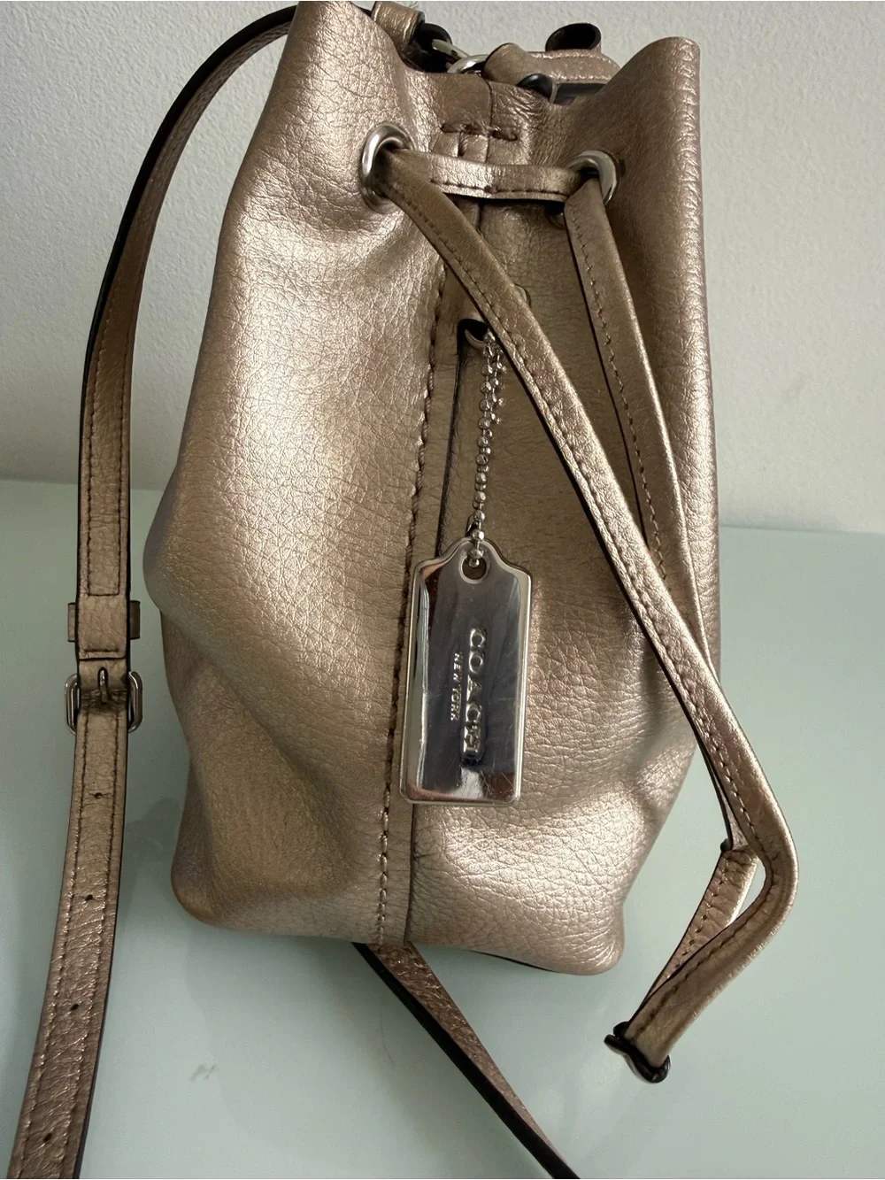 Coach Metallic Rose Gold Leather Drawstring Crossbody Bag